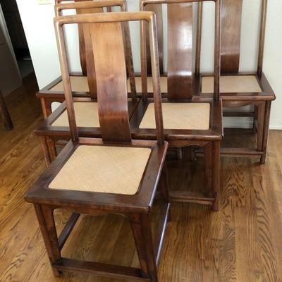 6 Walnut  armless dining chairs with wicker inset seat. (Selling with the dining table)