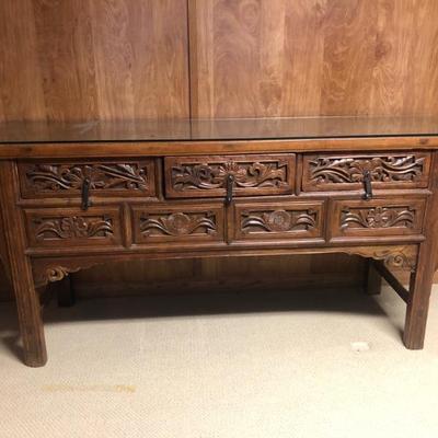 7 Drawer Chinese Carved Altar Table. Measures approx. 75.3/4in L x 21in D x 34in H.  Removeable glass on top added to protect top surface.