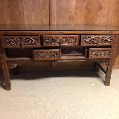 7 Drawer Chinese Carved Altar Table. The bottom drawers toggle. Push one drawer in to open the adjacent drawer. 