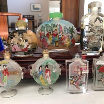 Vintage reverse painted snuff bottles.
