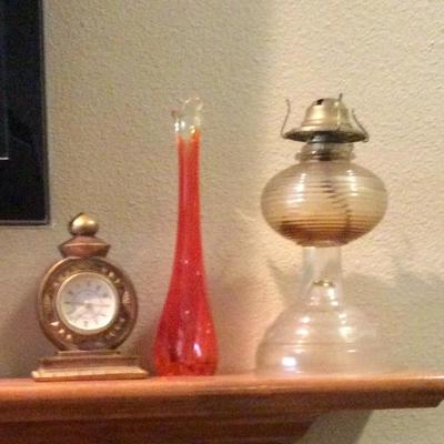 Oil lamp, orange vase, clock