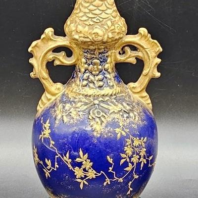 Porcelain Vase On Cast Iron Base 10
