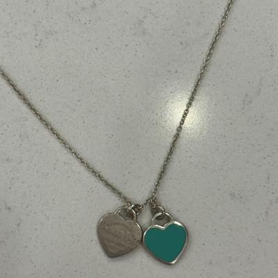Two Tiffany necklaces on display! One new with Tiffany box and bag!
