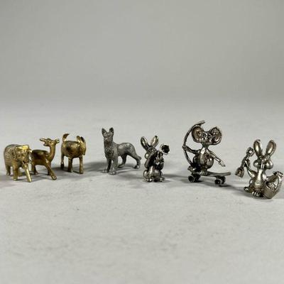 (7PC) MINIATURE ANIMAL FIGURINES | Mixed metal animal figurines including rabbits, a skateboarding mouse, wolf, goat, elephant, and more