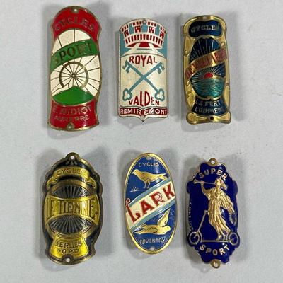 (6PC) BICYCLE BADGES | Includes: Super Sport ceramic & brass badge, Royal Valden, Devilliers Cycles, Lark Cycles,Le Tienne Cycles, and...