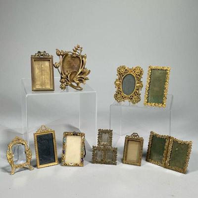 (10PC) SMALL BRASS & BRONZE PORTRAIT FRAMES | Floral and patterned brass & bronze portrait frames
