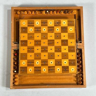 FOLDING PEG TRAVEL CHESS SET | Vintage miniature chess set with elevated board marked “Romania”