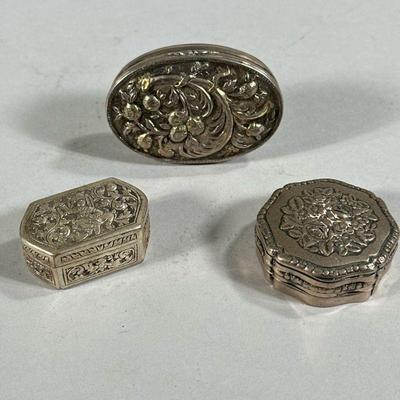 (3PC) SILVER SNUFF BOXES | Includes: oval snuff box with fruit decoration stamped on top (1.4 ozt), Round floral decorated snuff box...
