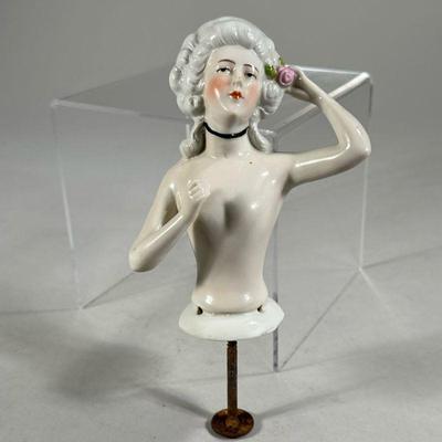 PORCELAIN PIN CUSHION DOLL | German porcelain half doll showing woman with flower in her hair, marked on back 