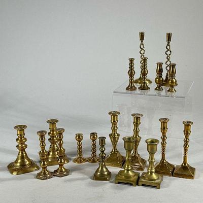MINIATURE TURNED BRASS CANDLESTICKS | Includes various styles of turned brass candlesticks, 7 pairs, 1 set of 4 and one individual...
