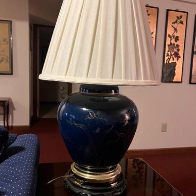 Pair navy Asian ginger jar lamps with pleated shades