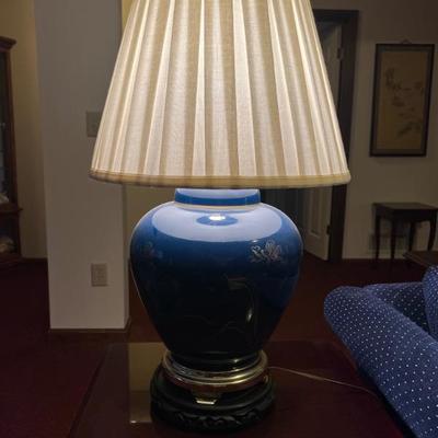 Pair navy Asian ginger jar lamps with pleated shades