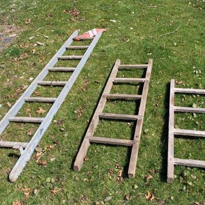 Vintage wooden ladders in old paint