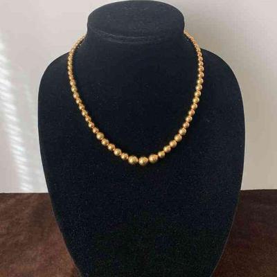 Gold bead necklace