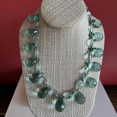Very pretty graduated necklace of aquamarine colored teardrop crystals