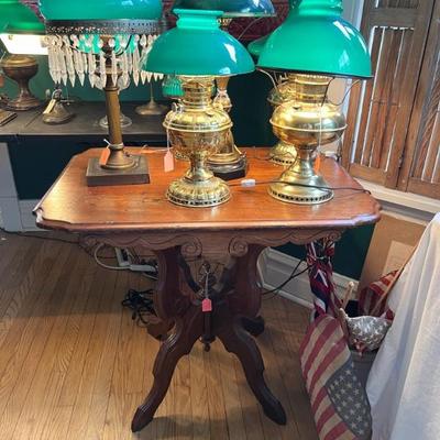 lots of antique lamps with green glass banker's shades