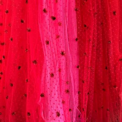 1980s Bob Mackie couture dress in red, red and hot pink lace bodice with full tulle skirt layered in red, lavender, pink and orange with...