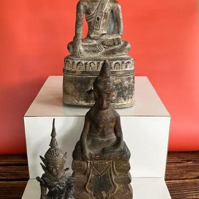 A collection of 18th century bronze and wood Thai Buddha figures