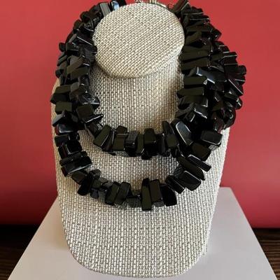 Very fun and modern chunky necklace made of large black, rectangular glass beads with a silver clasp