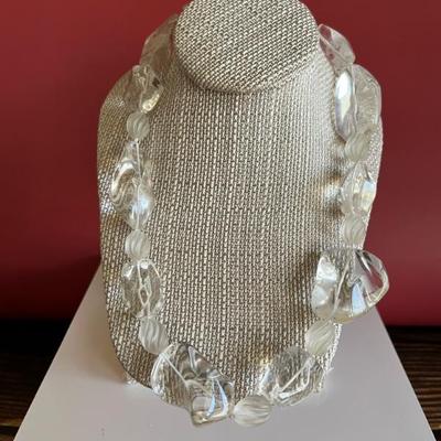 
Very striking and modern necklace of chunky large rough clear crystal with a silver clasp
