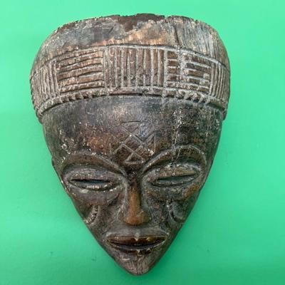 Chokwe mask, African tribal mask art, this mask represents Pwo which honors the founding female ancestors. The central cuneiform on the...