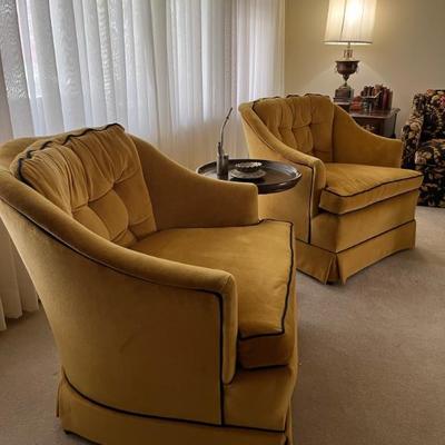Pair of mid century club chairs, upholstered on gold velvet with black trim, by Shaw