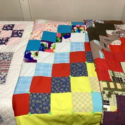 NIAB103 Old Quilt Trio	First quilt is the lightest one. Looks to be made of cotton. Has some yellowing on the white side, with just a...