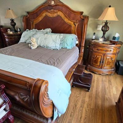 Michael Amini bedroom furniture set: dresser with mirror, 2 nightstands, king-size bed, armoire, tall chest of drawers, and chest.