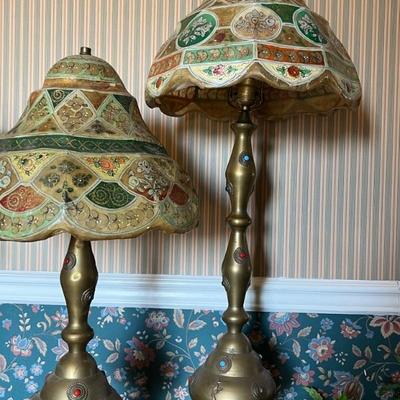 Middle Eastern bronze lamps with hand painted camel skin lamp shades.