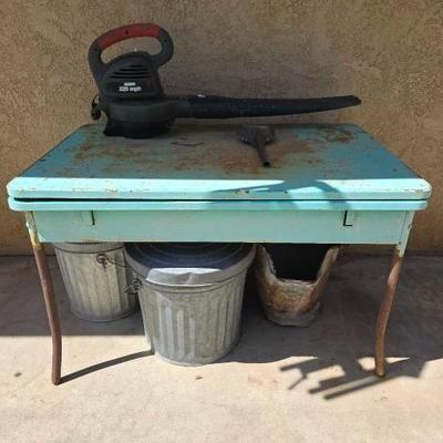 #5052 â€¢ Metal Table Two small Metal Trash Cans Leaf Blower
