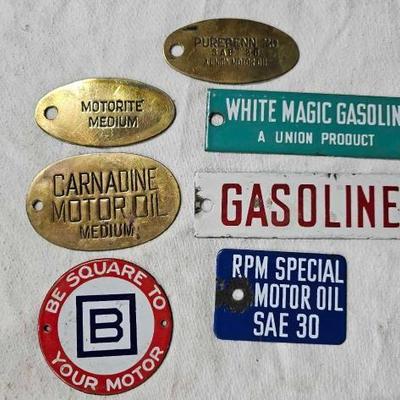 #2320 â€¢ 3 Brass and 4 Porcelain Oil and Gasoline Tags
