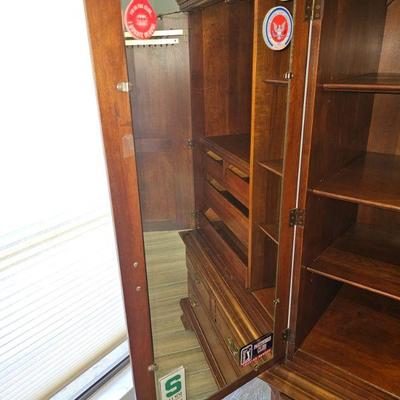 This a nicely constructed armoire, it has slight blemishes on the front of the cabinet