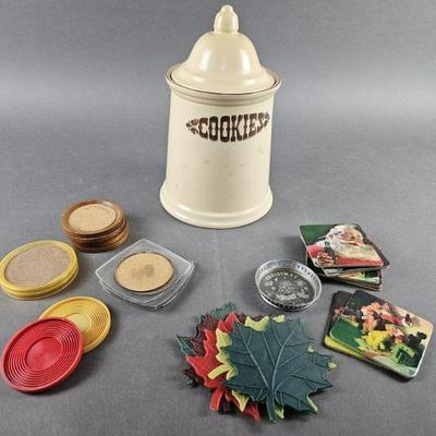Lot 45 | Vintage Pfaltzgraff Village Cookie Jar & Coasters