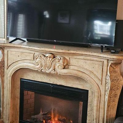 Electric fireplace and large flat-screen TV purchased last year