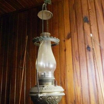 Iron frame, embossed brass lamp, original chimney.  Excellent Old Brass Country Store Kerosene Hanging Lamp. 
