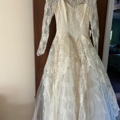 1959 â€¢ Wedding Dress â€¢ Long Sleeve â€¢ Illusion Neckline â€¢ Ball Gown Length â€¢ Sequin Embellishment â€¢ 24â€ Waist .â€¢ $129