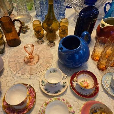 The family has decided to keep the teacups.  They will not be included in the sale. Nor will the decanter set in this photograph.
