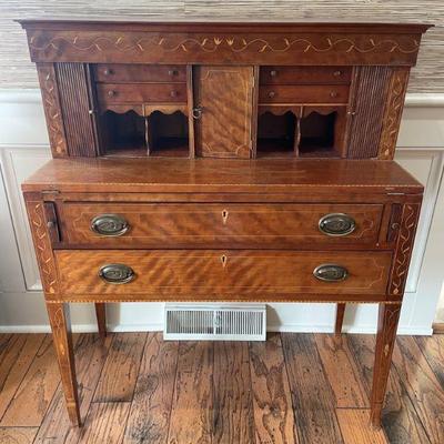 Spectacular vine inlay on this 19th century ladies writing desk with tambour doors.