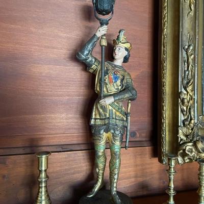 A pair of polychrome figures with torcheres candle sticks