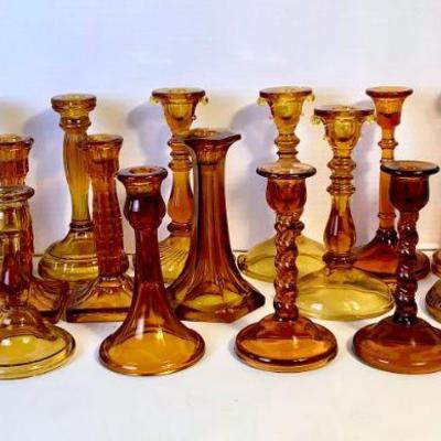 DILA217 Candlestick Assortment	18 amber color Candlestick, different sizes and styles.
