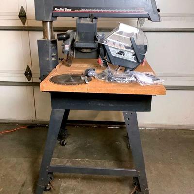 NOBE221 Craftsman 10" Radial Saw & More	Has a 2.75 HP motor, does move up and down to adjust the blade elevation. Model #...