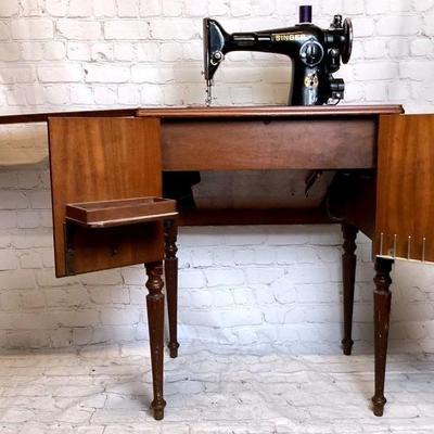 BIHY956 Antique Singer Sewing Machine	Singer sewing machine, and extendable tabletop. Comes with original power cord, but machine is...