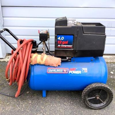 NOBE225 DeVilbiss Air Power Air Compressor	12 gallon tank with a 4.0hp motor. Comes with hose and air attachments.Â 
