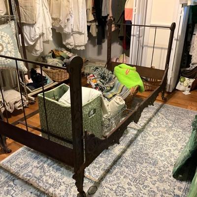 late 1800’s iron daybed with cherub. Twin size