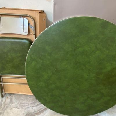 Samsonite round 40in., green vinyl, 4 folding chairs, still in box