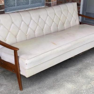 Mid century sofa converts to a bed