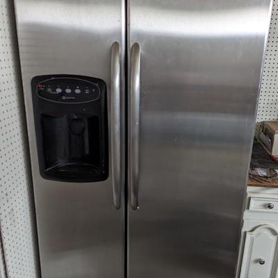 Used Side by Side Maytag in garage. Has door you must shut yourself to close tight.$100.