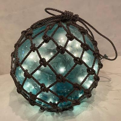 Glass orb filled with fairy lights $60