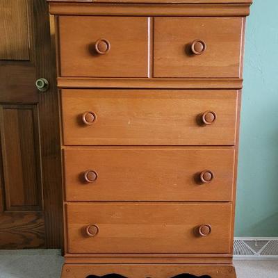 Tall boy type dresser, solid work, very sturdy and functional.