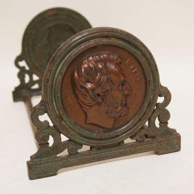 1101	ANTIQUE CAST METAL ABRAHAM LINCOLN ADJUSTABLE BOOK ENDS,CLOSED APPROXIMATELY 9 1/2 IN X 5 1/2 IN H, OPEN 14 1/4 IN
